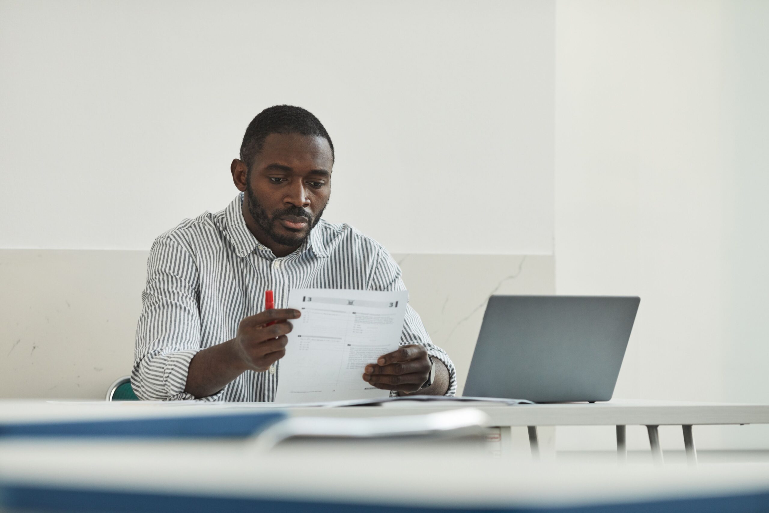 skilled nigerian professional preparing document assessments for canada express entry