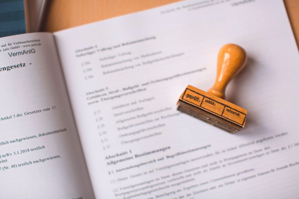 A close-up shot of an official registration certificate showing a verified germany address next to a corporate employment contract