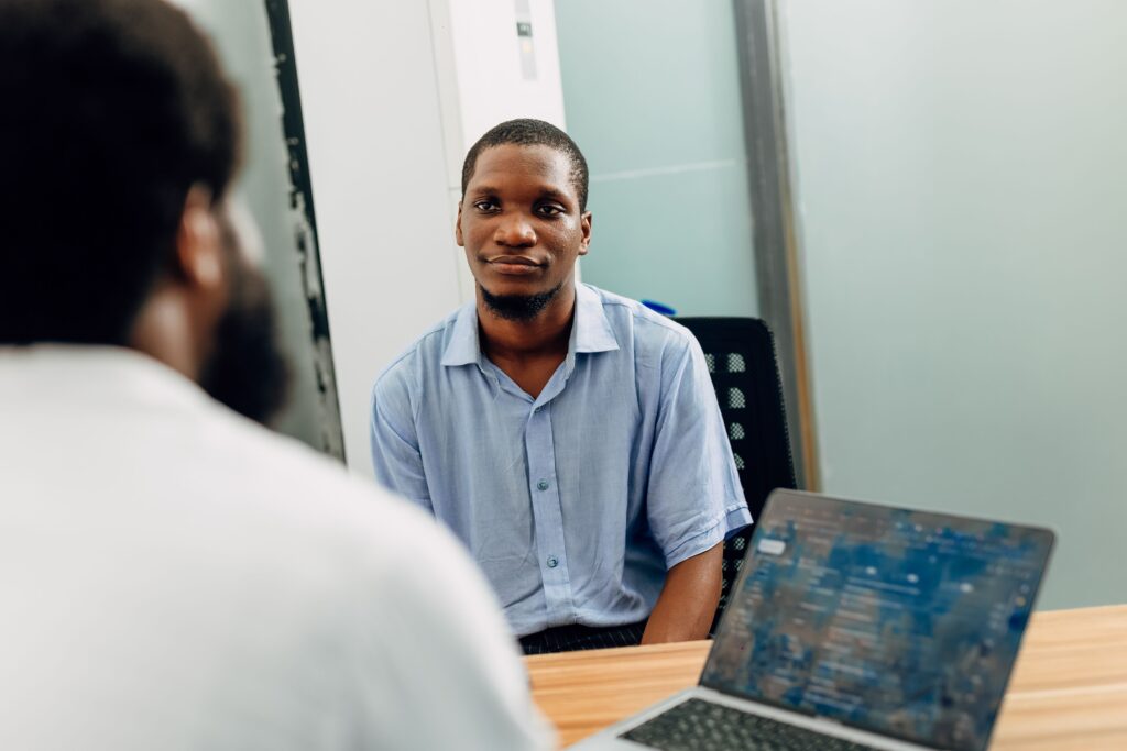A professional candidate checking an online portal for recruitment updates after submitting a modified german cv