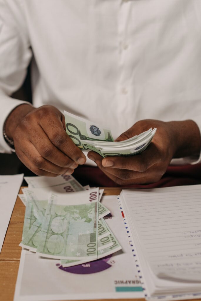 a man counting money for business investment by Nigeriians in Diaspora