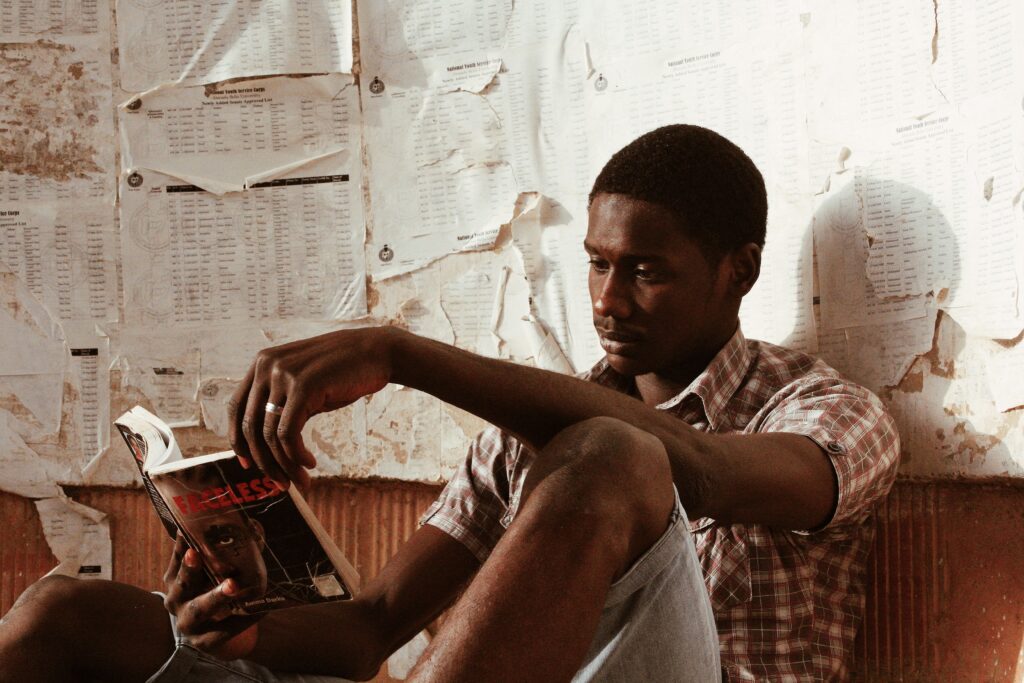 A stressed Nigerian migrant holding an expired green document while waiting to renew their passport italy