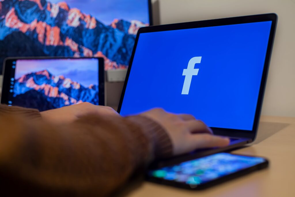 A laptop displaying various diaspora facebook groups for Nigerians living in Canada and the UK